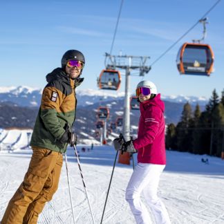 Couple skiing on the Kreischberg (c) Kreischberg | Tom Lamm