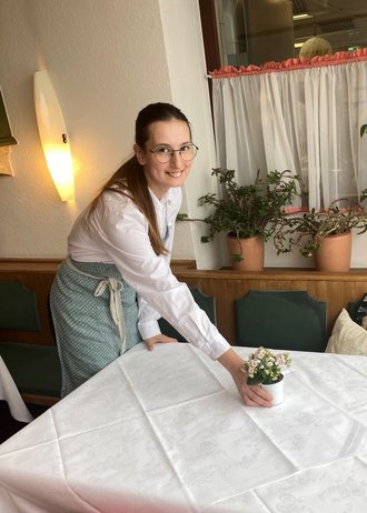 Natascha setting the table in Murau Gasthof Hotel Lercher