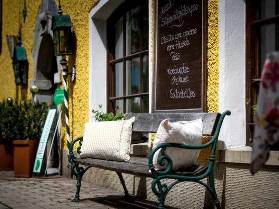 Bench in front of the Murauer Gasthof Hotel Lercher.