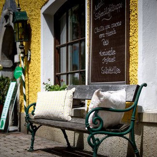 Bench in front of the Murauer Gasthof Hotel Lercher.