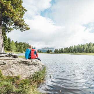 Couple at the lake in fall. Couple at the lake in fall.