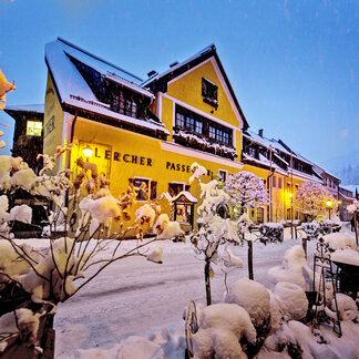 Murauer Gasthof Hotel Lercher in a winter evening. Murauer Gasthof Hotel Lercher in a winter evening.